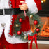 Singing and Dancing Santa Claus with Gift and Wreath